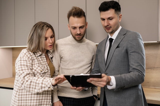 Property manager showing a page to two people