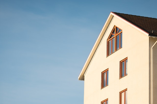 Beige cement house against a blue sky